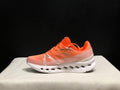 Coral and White On Cloudsurfer Running Shoes - product image from the listing.