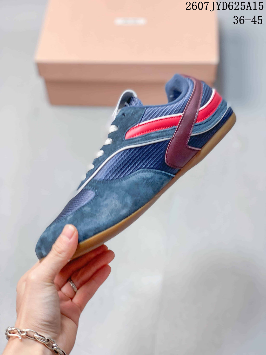 Miu Miu Gymnasium Low-Top Sneakers in Navy Red 2607JYD625A15 - product image from the listing.