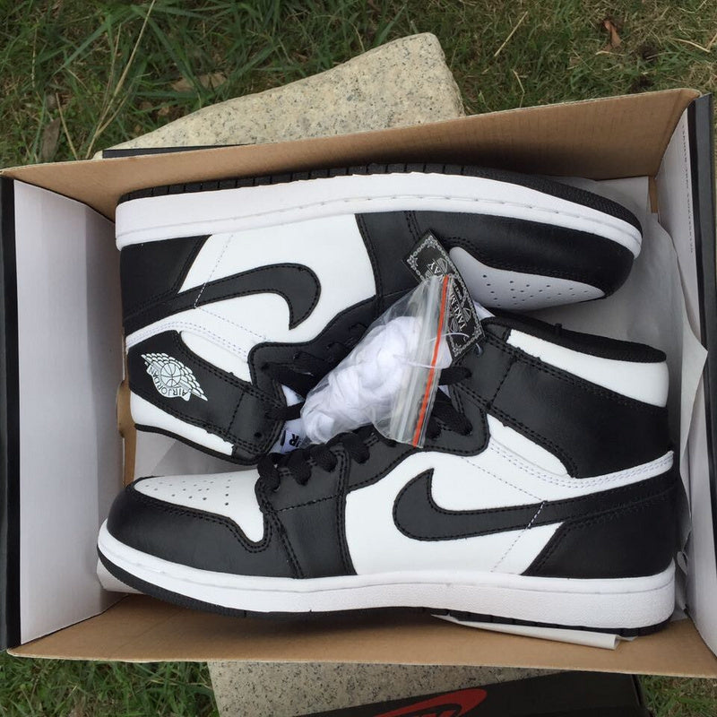 Jordan 1 High Sneakers in Black and White - product image from the listing.