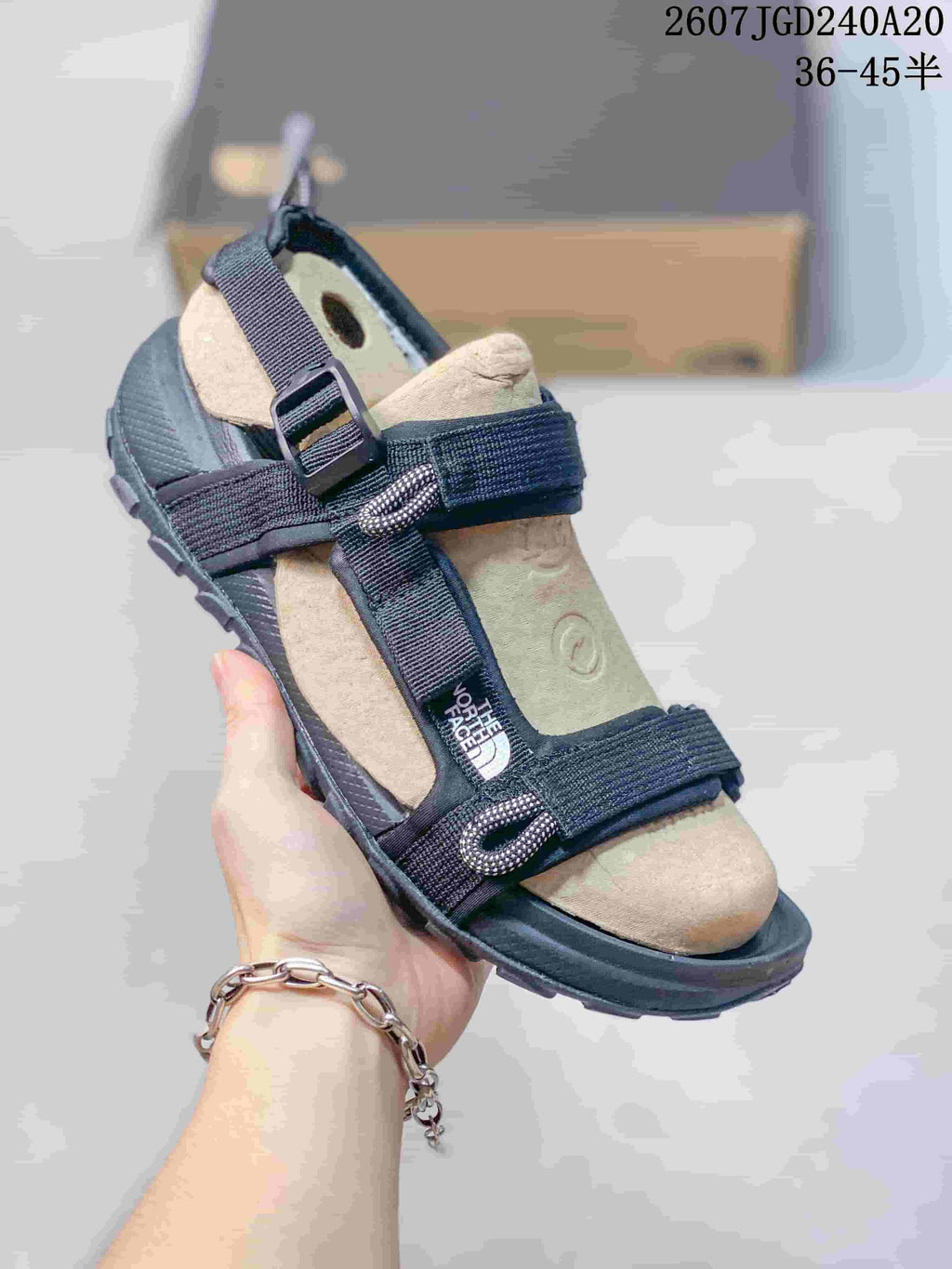 The North Face Explore Camp Sandals in Black and Tan JGD240A20 - product image from the listing.