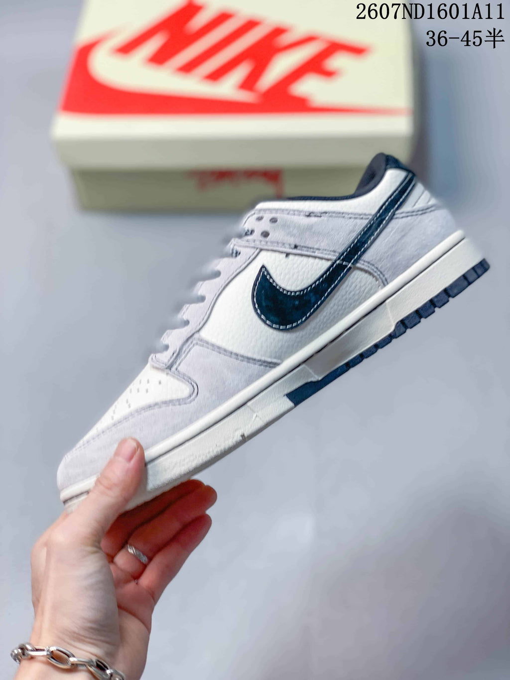 Nike SB Dunk Low Sneakers in Off-White White Navy 2607ND1601A11 - product image from the listing.