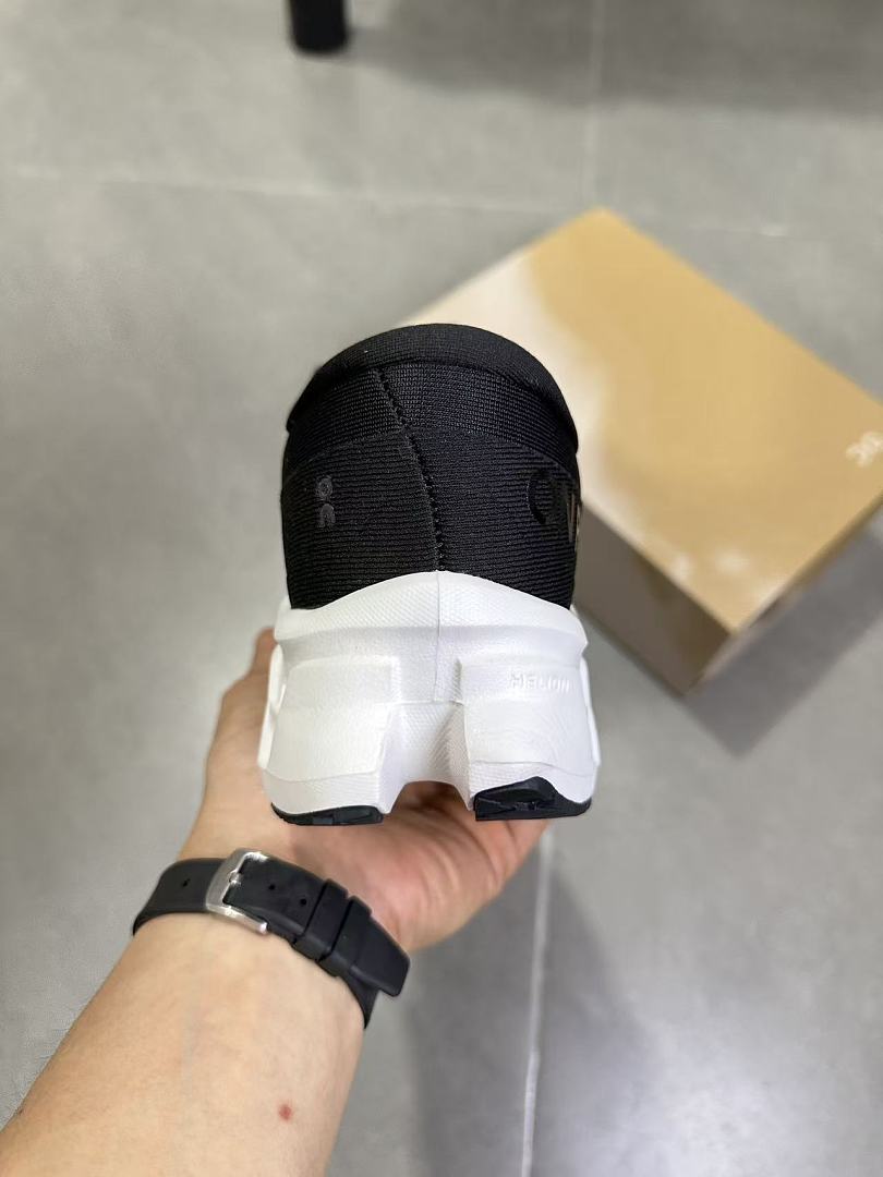 On Running Black and White Road Sneakers for Running - product image from the listing.