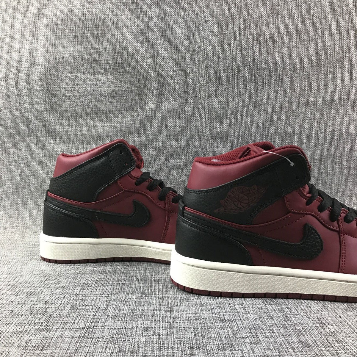 Air Jordan 1 Mid High-Top Sneakers in Burgundy and Black - product image from the listing.