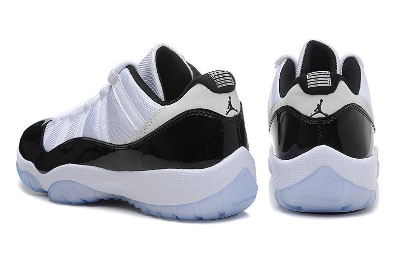 Air Jordan 11 Low Basketball Sneakers in White Black - product image from the listing.
