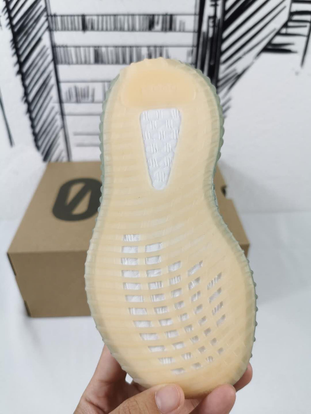 Grey and Orange Yeezy 350 V2 Kids Sneakers - product image from the listing.