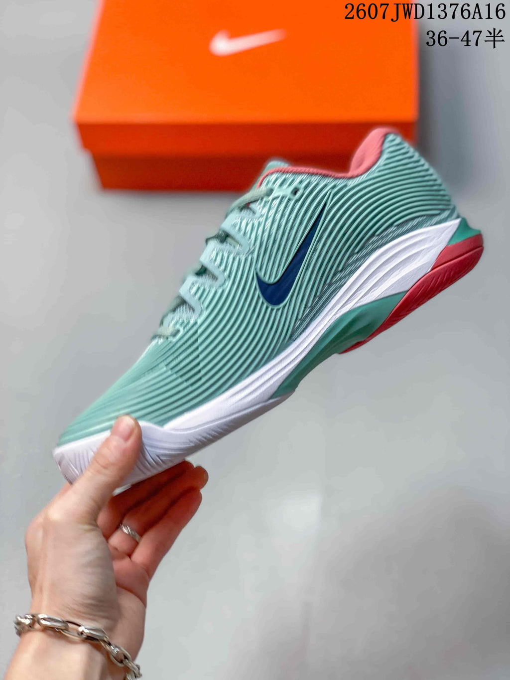 Mint Green and Coral Nike Vapor 12 Low-Top Tennis Sneakers - product image from the listing.