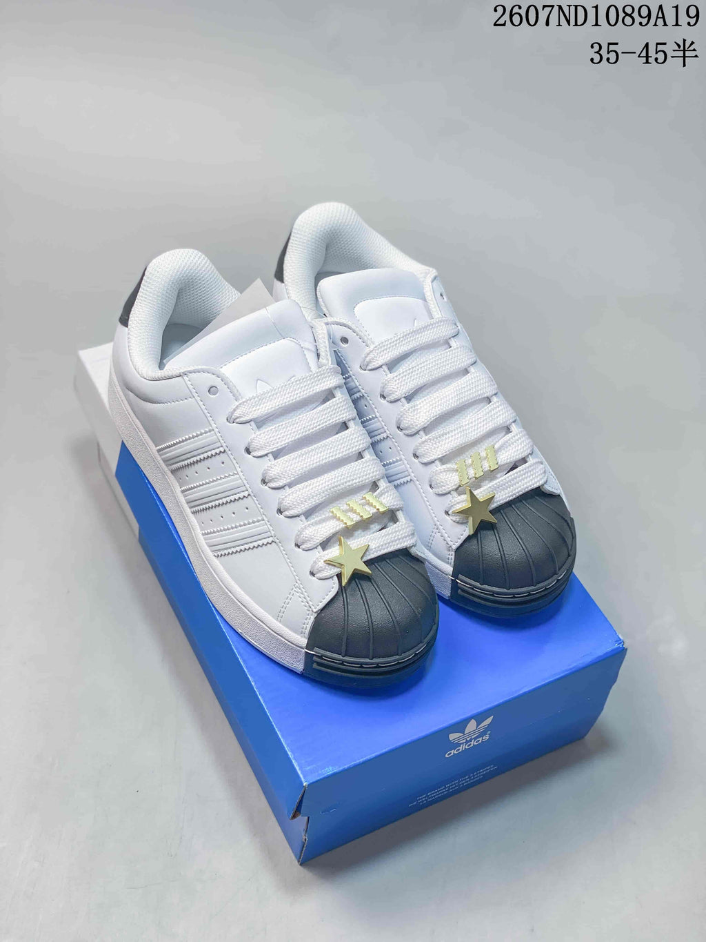 Adidas Superstar Sneakers in White Black Gold 2607ND1089A19 - product image from the listing.
