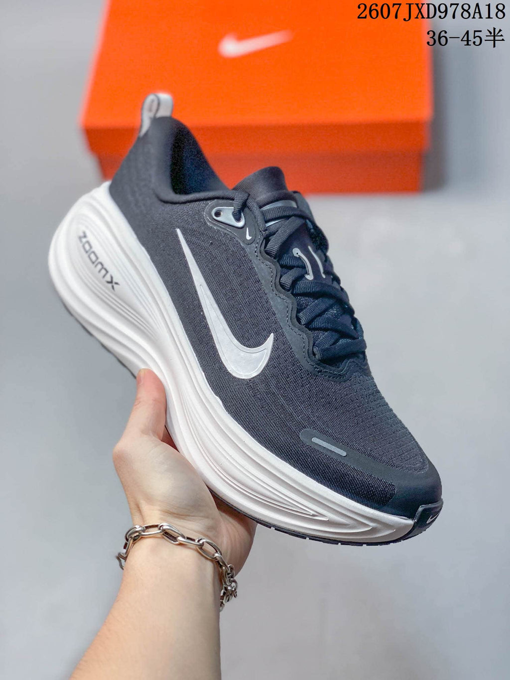 Nike Vomero Plus Running Sneakers in Dark Gray White 2607JXD978A18 - product image from the listing.
