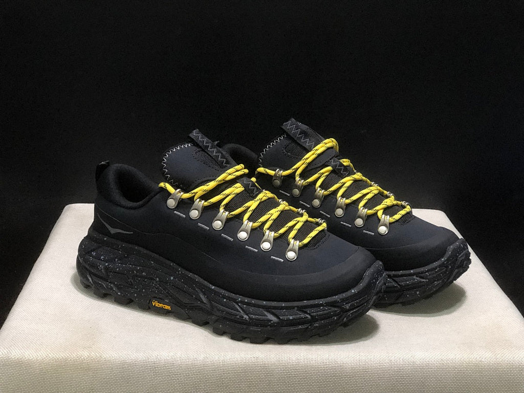 HOKA Tor Summit Trail Sneakers in Black and Yellow - product image from the listing.