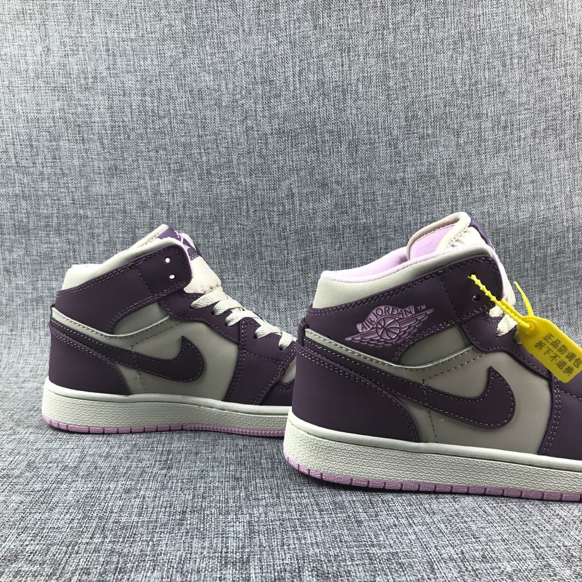 Air Jordan 1 Retro High OG Sneakers in White Purple - product image from the listing.