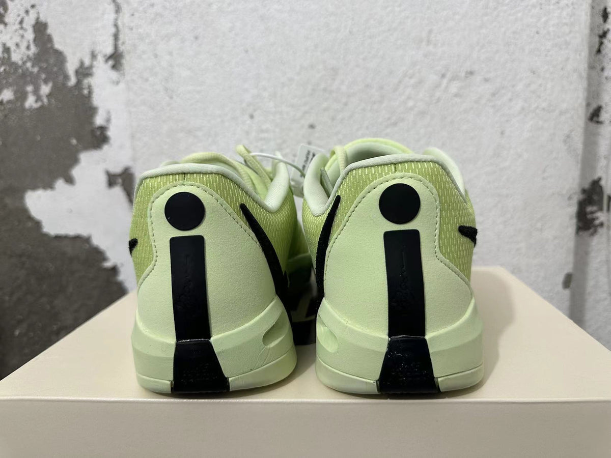 Pale Yellow and Black Nike Zoom Basketball Shoes - product image from the listing.