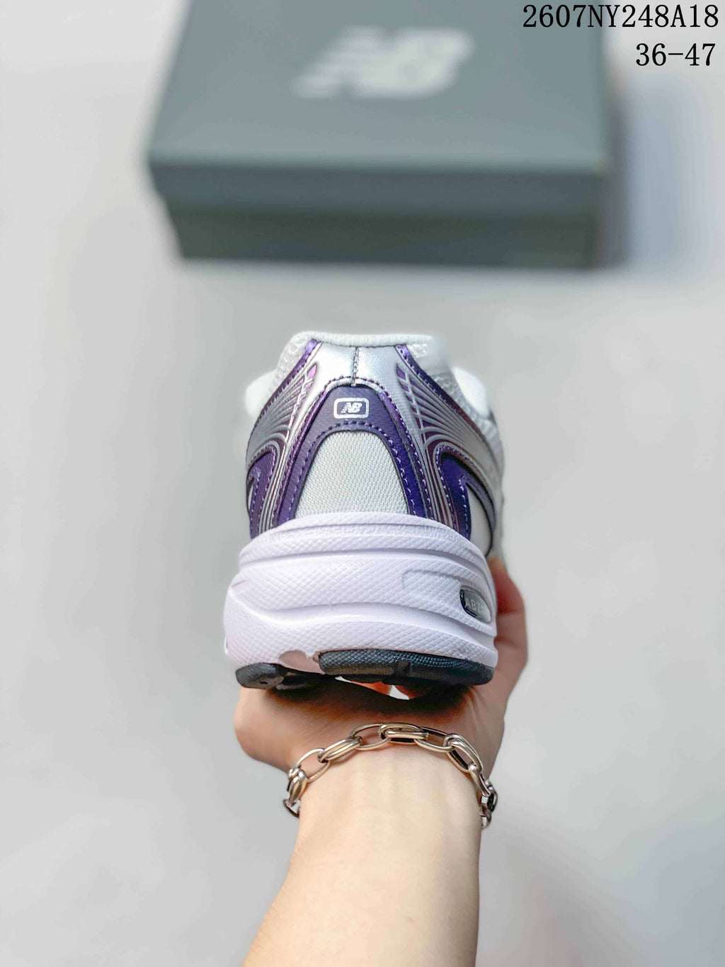 New Balance 740 Sneakers in White and Purple - product image from the listing.