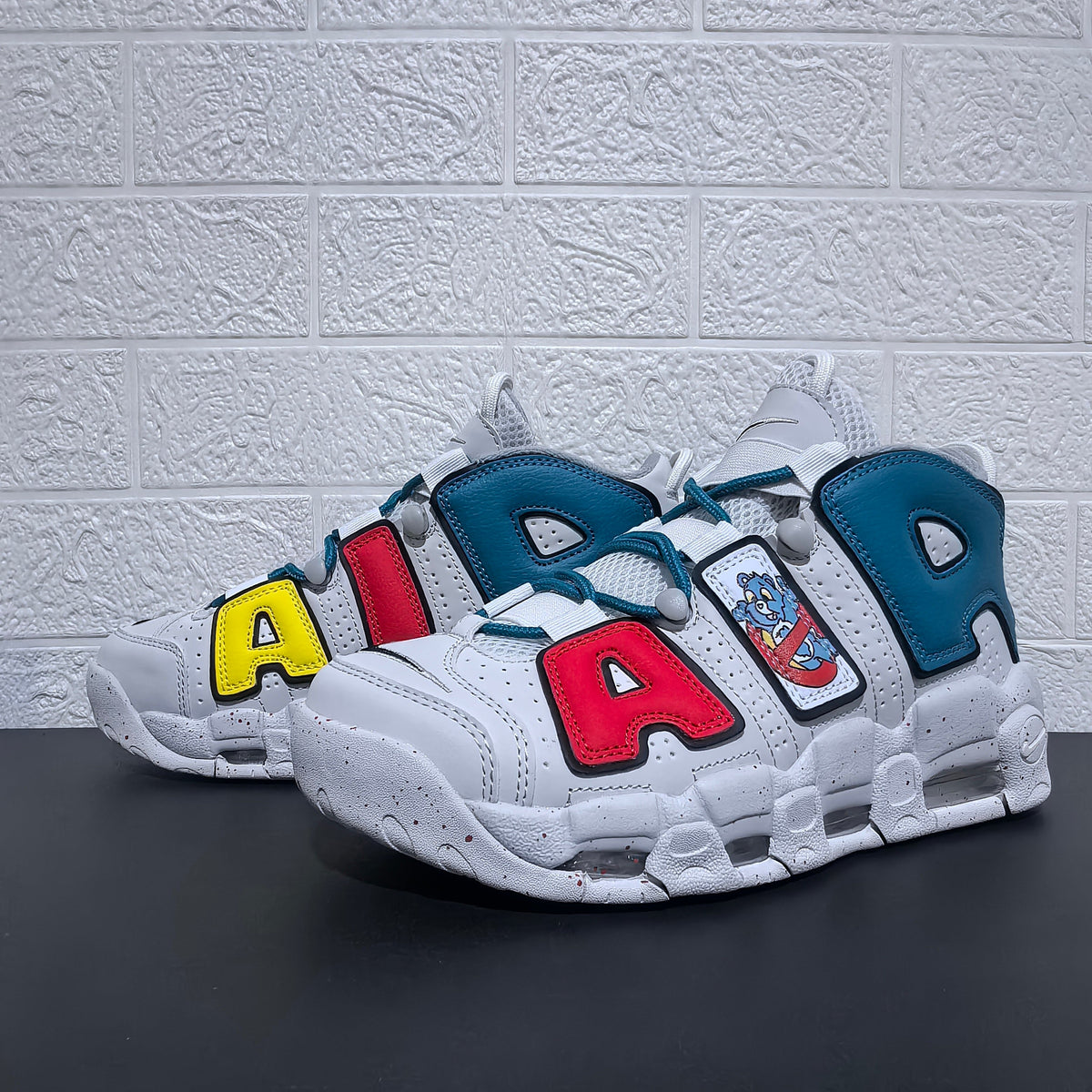Nike Air More Uptempo Cartoon Bear Sneakers, in White Blue Red - product image from the listing.
