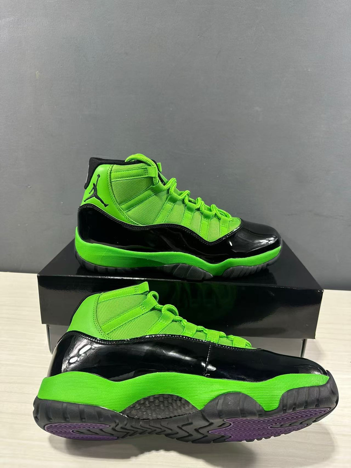 Air Jordan 11 Retro Sneakers in Black Green CT8012-310 - product image from the listing.