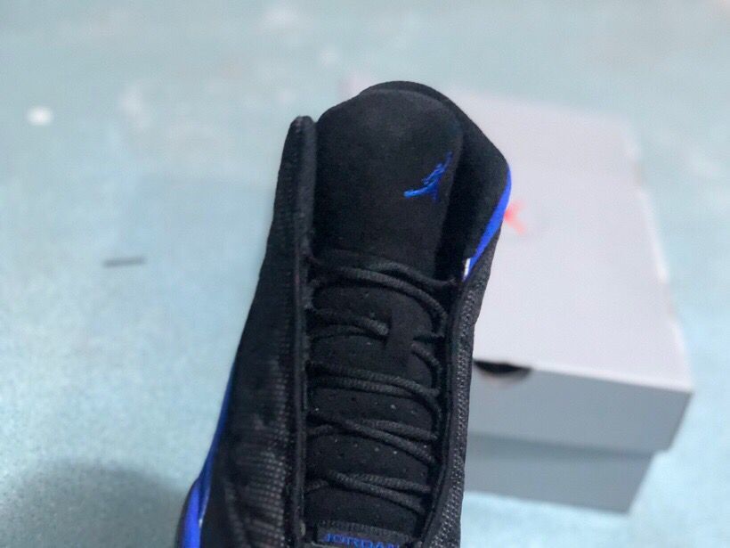 Jordan 13 Retro Sneakers Black/Royal in Blue - product image from the listing.