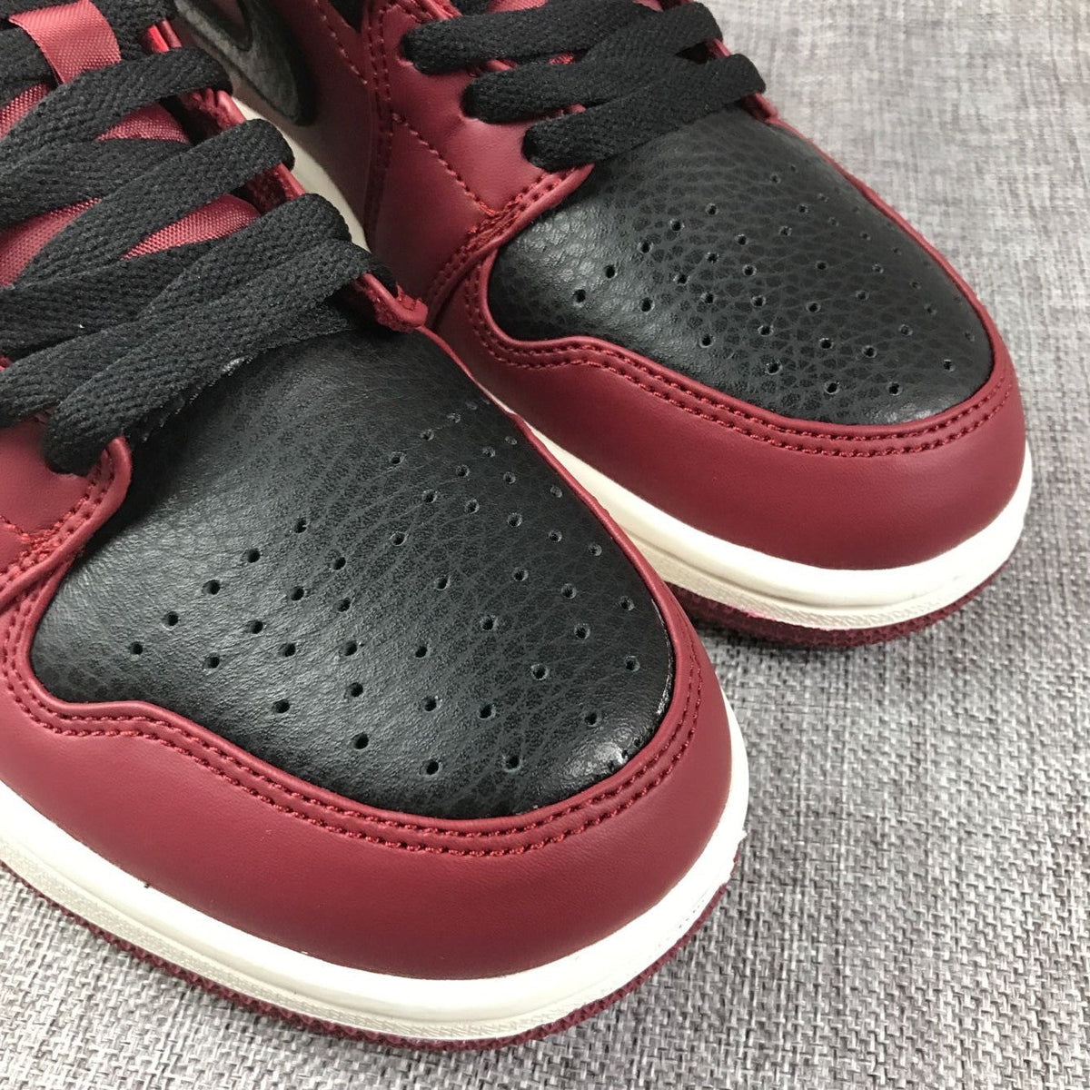 Air Jordan 1 Mid High-Top Sneakers in Burgundy and Black - product image from the listing.