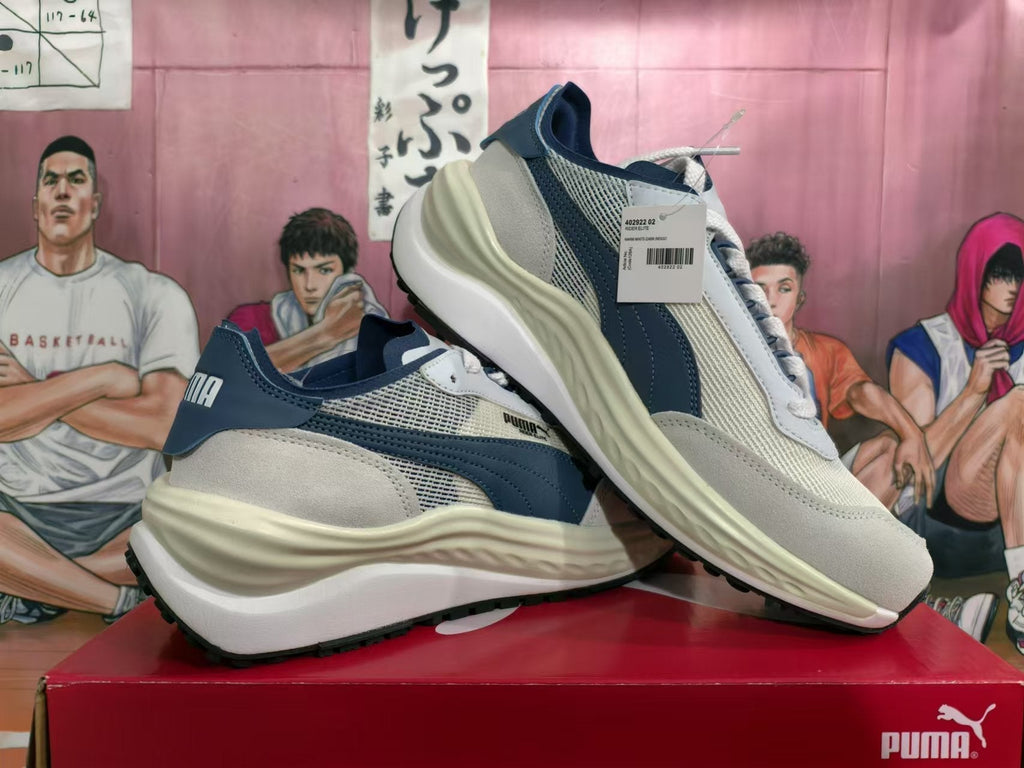 White and Navy PUMA Rider Elite Sneakers - product image from the listing.