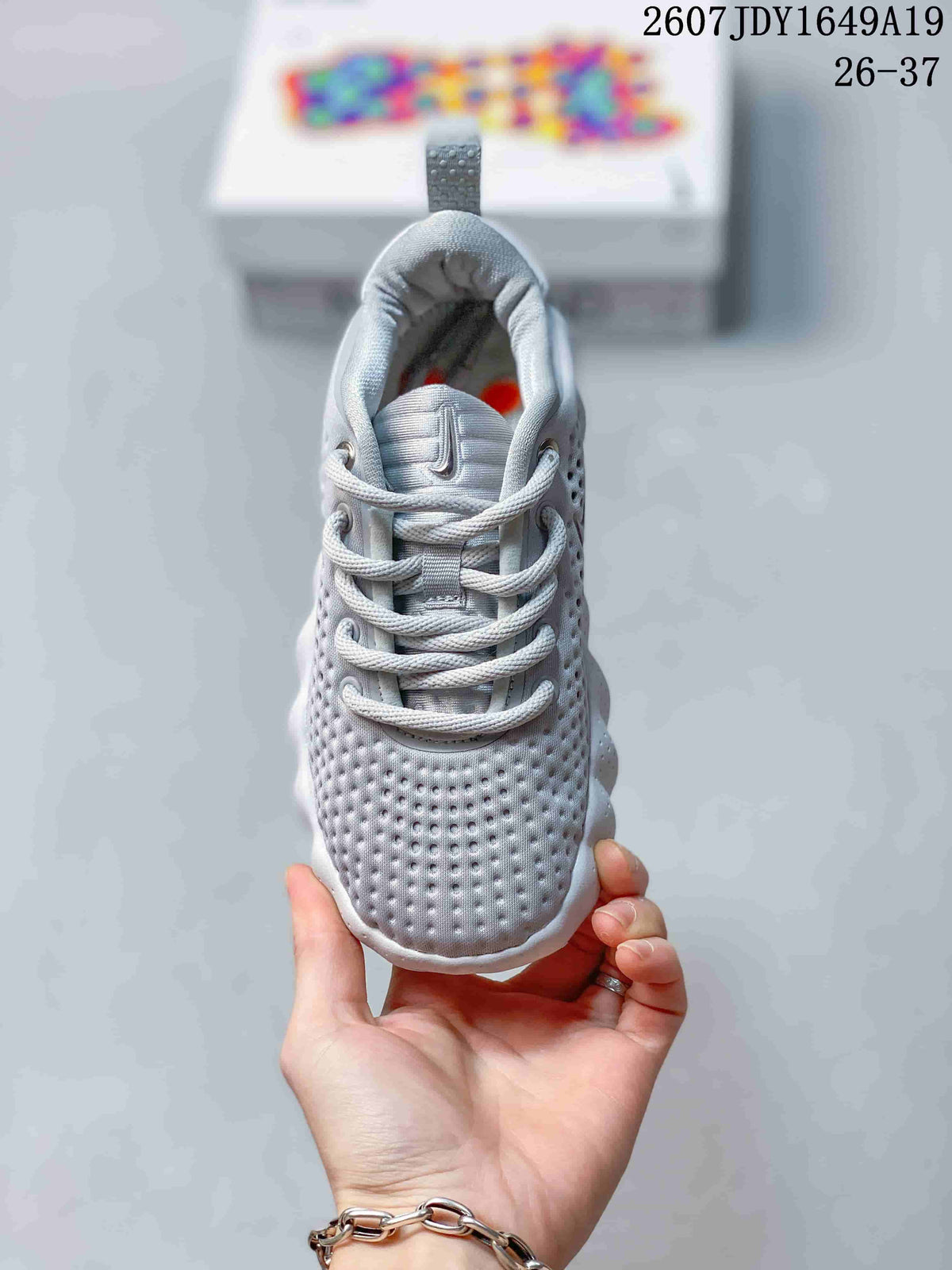 Nike Mind 002 Kids' Sneakers in White and Grey - product image from the listing.