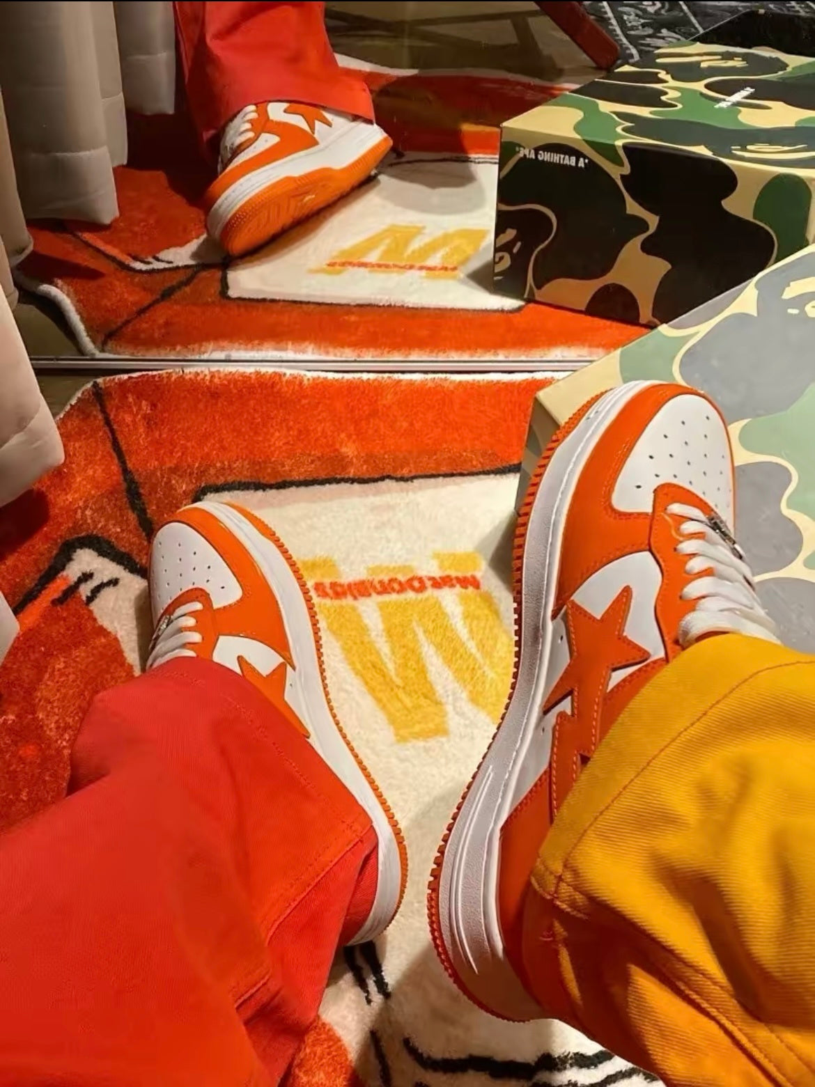 A Bathing Ape BAPE STA Low Sneakers in White Orange - product image from the listing.