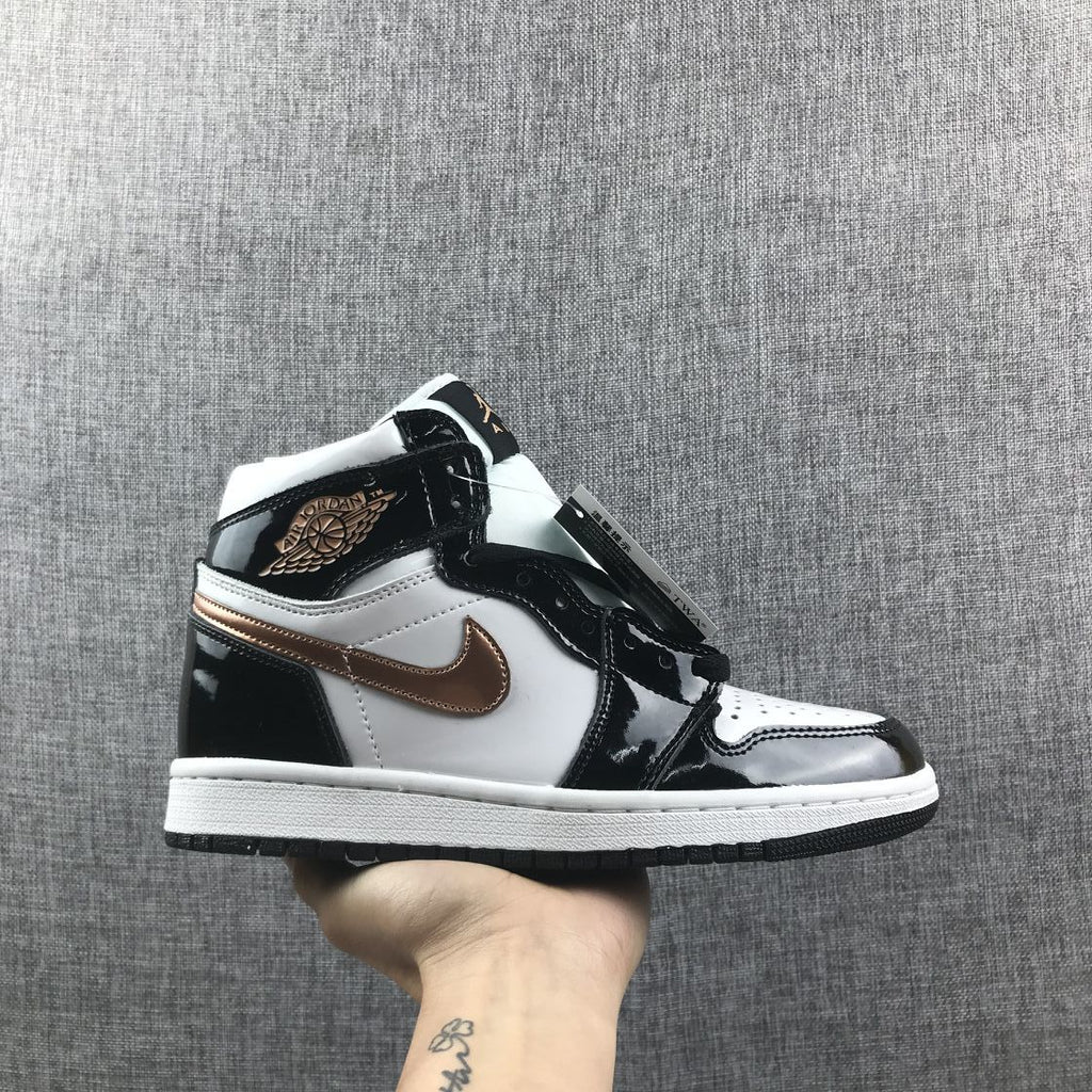 Air Jordan 1 Mid Sneakers in Black White Metallic Gold 852542-007 - product image from the listing.