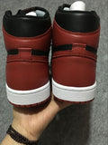 Air Jordan 1 High Sneakers in Black and Red - product image from the listing.