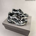 Black and White Balenciaga Runner Low-Top Sneakers - product image from the listing.