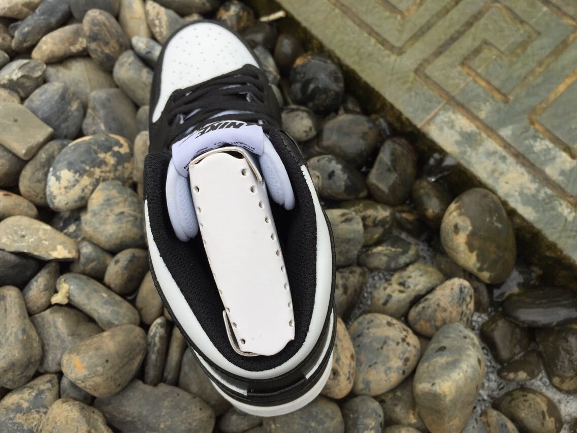 Women's Jordan 1 High Black and White Sneakers - product image from the listing.
