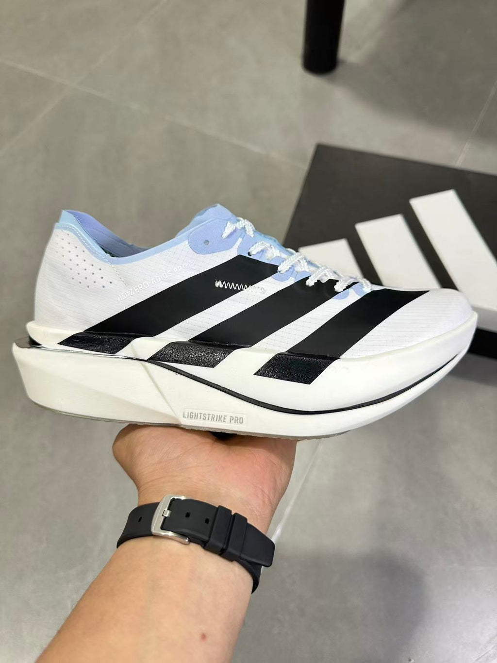 adidas Lightstrike Pro Running Shoes in White Blue KI8298 - product image from the listing.