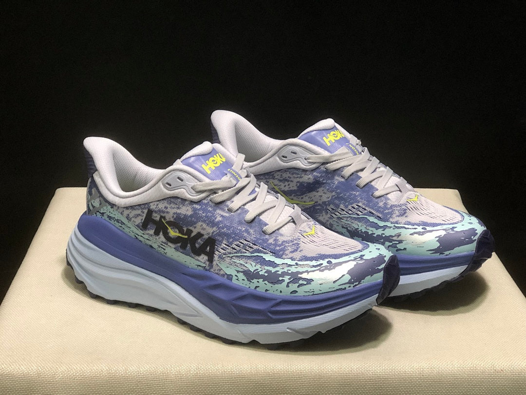 Purple and Mint HOKA Stinson 7 Running Shoes - product image from the listing.