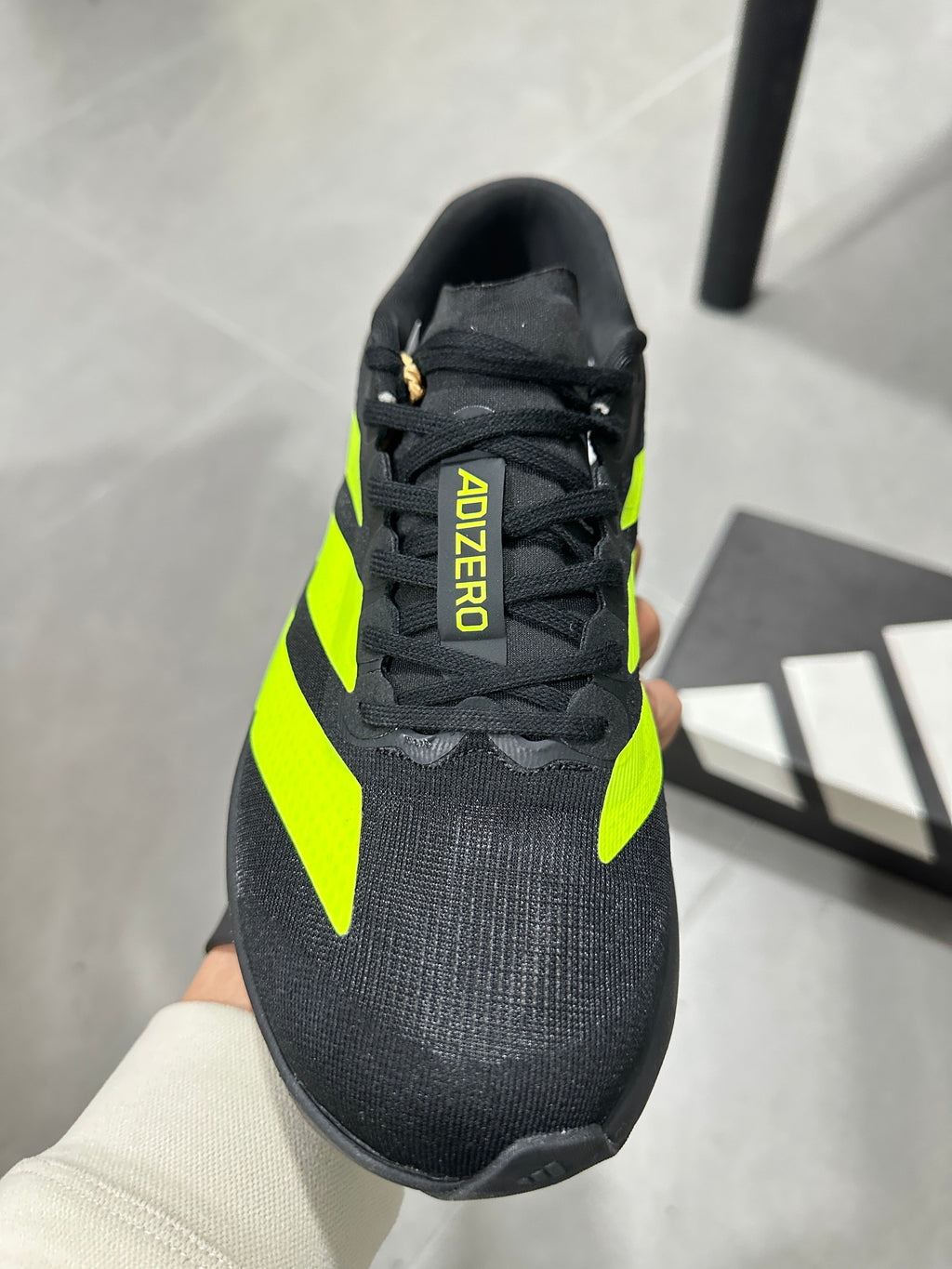Adidas Adizero Running Shoes in Black and Volt Green JS3420 - product image from the listing.