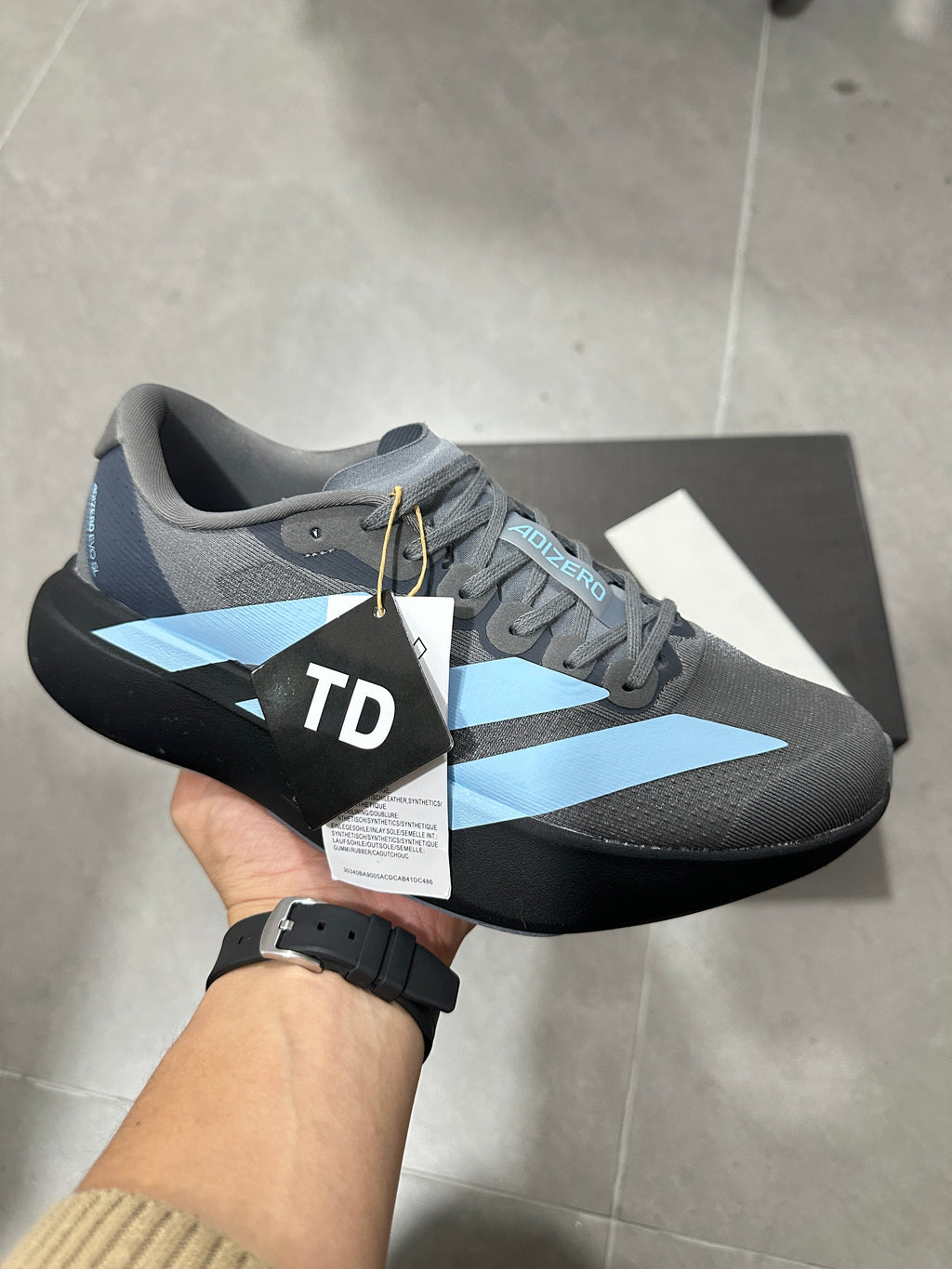 Grey and Blue Adizero Lightstrike Pro Running Shoes - product image from the listing.