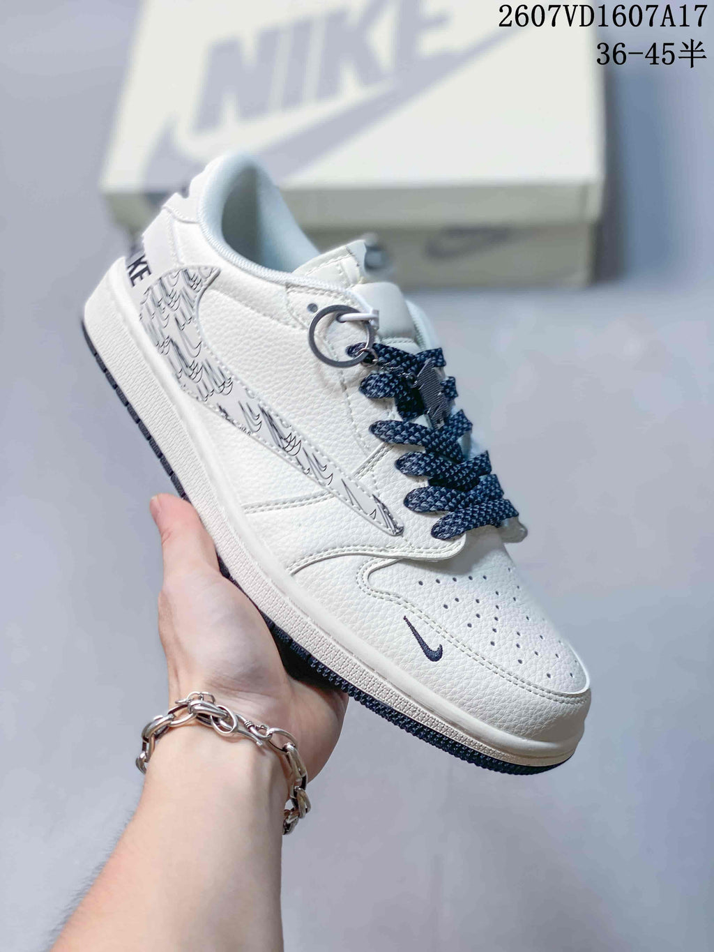 Travis Scott x Jordan 1 Low Sneakers in White Black 2607VD1607A17 - product image from the listing.