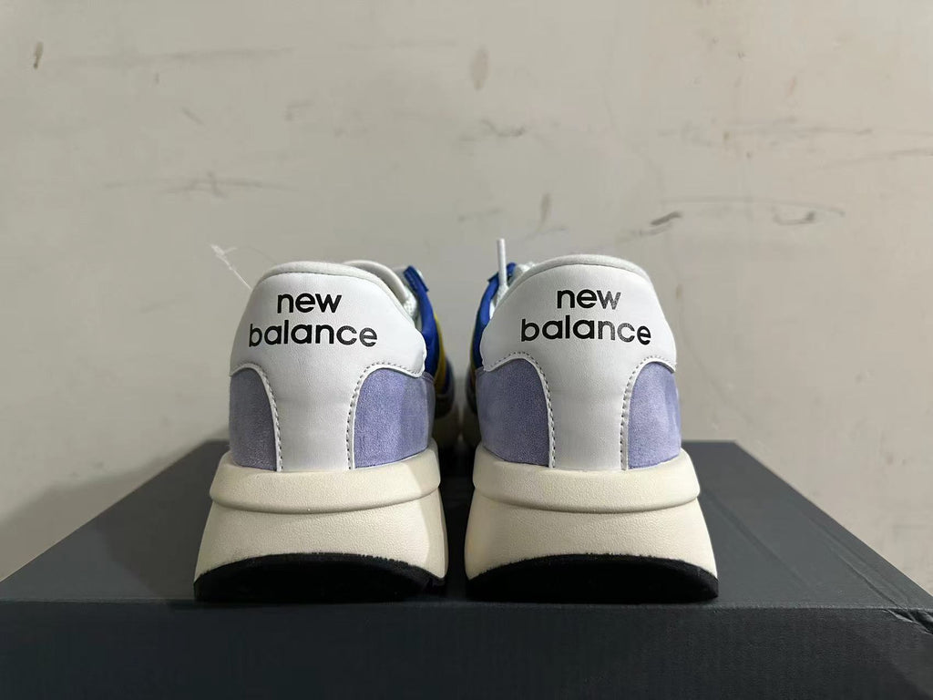 New Balance U370 Sneakers in Blue and Yellow - product image from the listing.