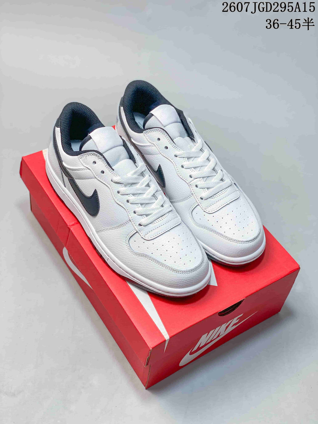 Nike SB Dunk Low Pro Sneakers in White Black 2607TGD295A15 - product image from the listing.