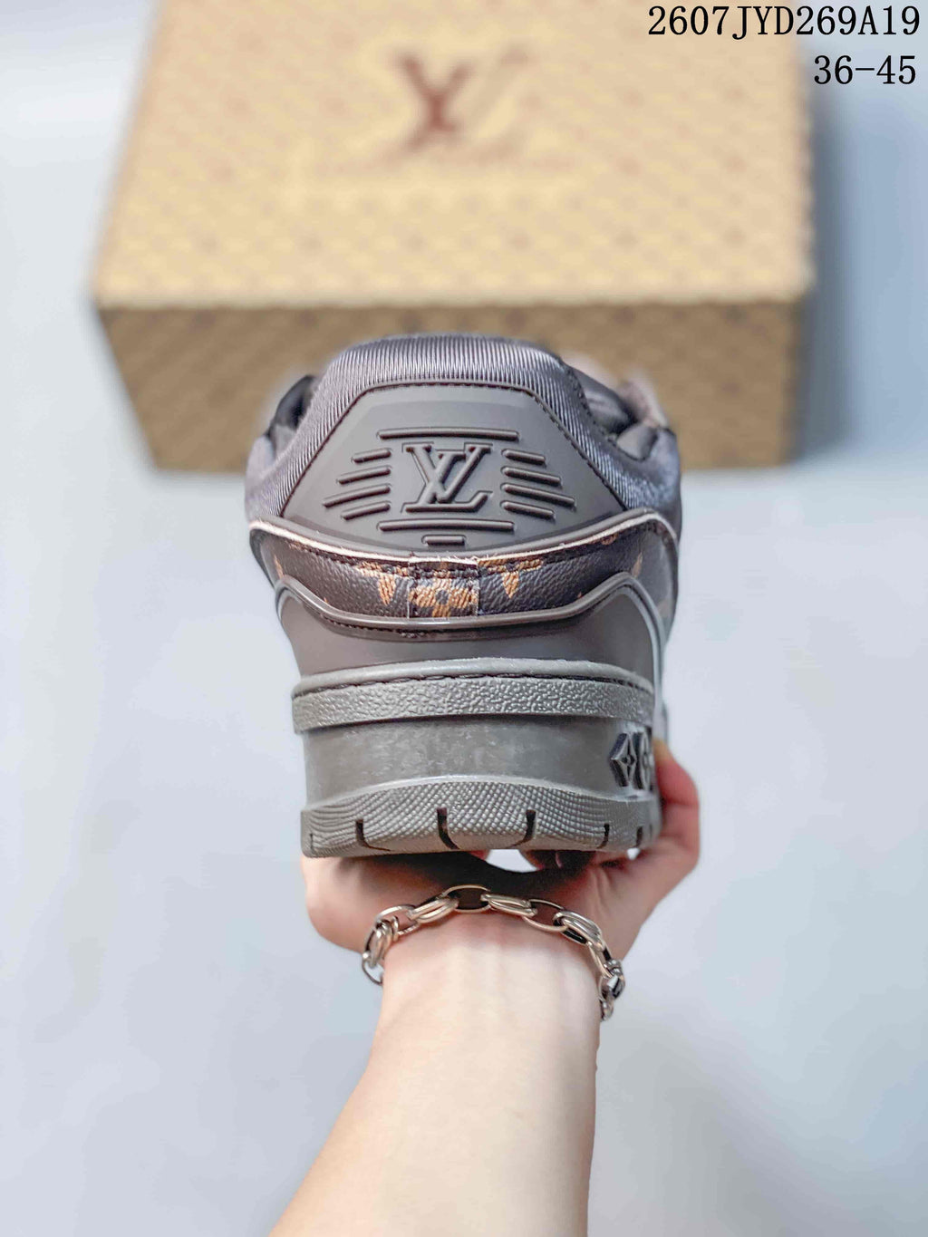 Louis Vuitton Trainer Maxi Low-Top Sneakers in Brown - product image from the listing.