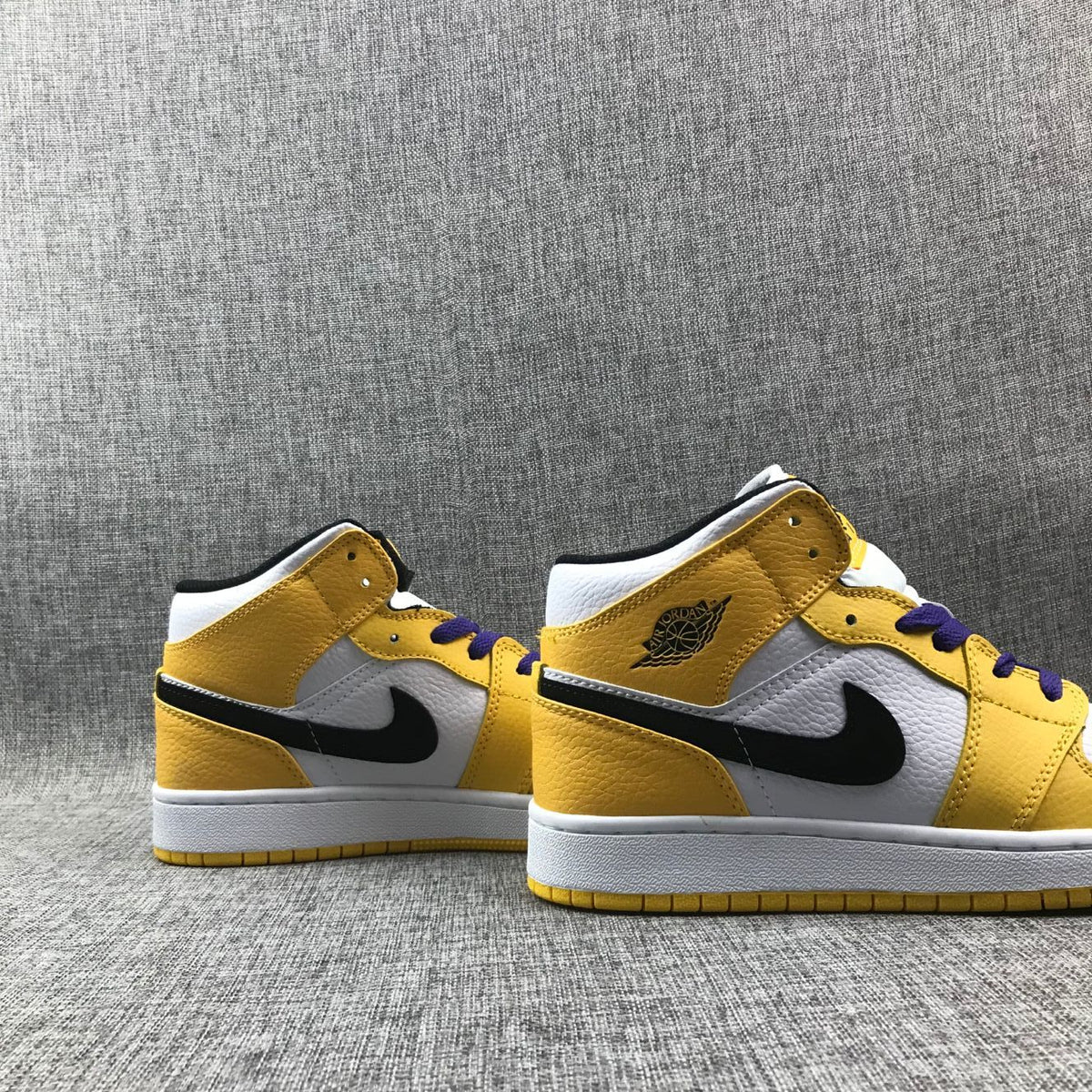 Air Jordan 1 Mid Lakers Sneakers in Yellow and Purple BQ6931-700 - product image from the listing.