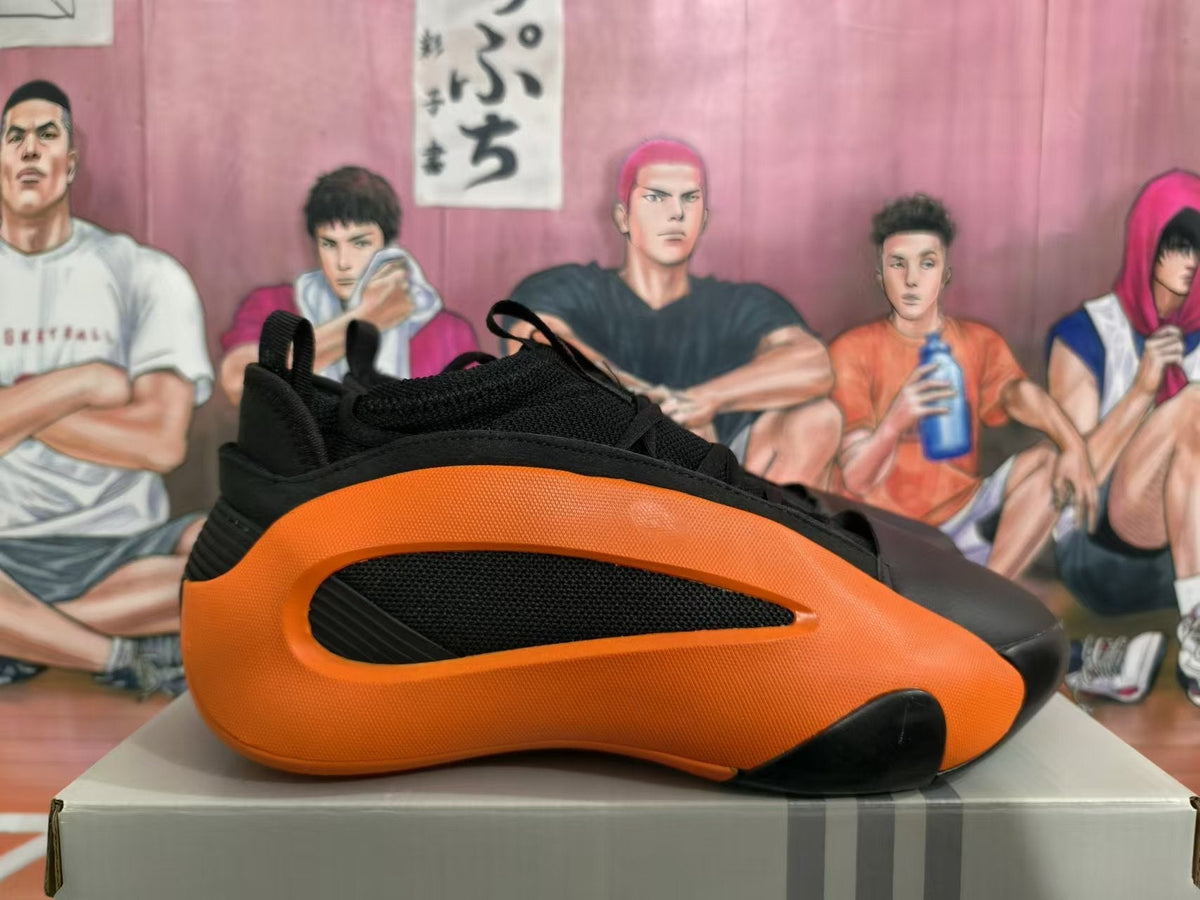 Basketball Sneakers in Black and Orange - product image from the listing.