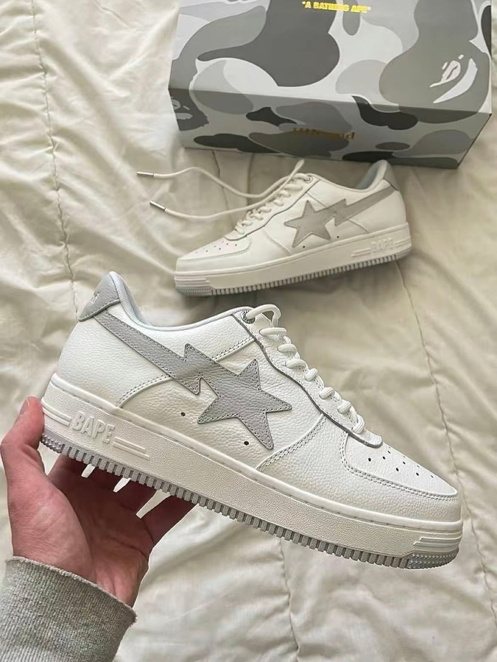 White and Grey BAPE STA Low Sneakers - product image from the listing.