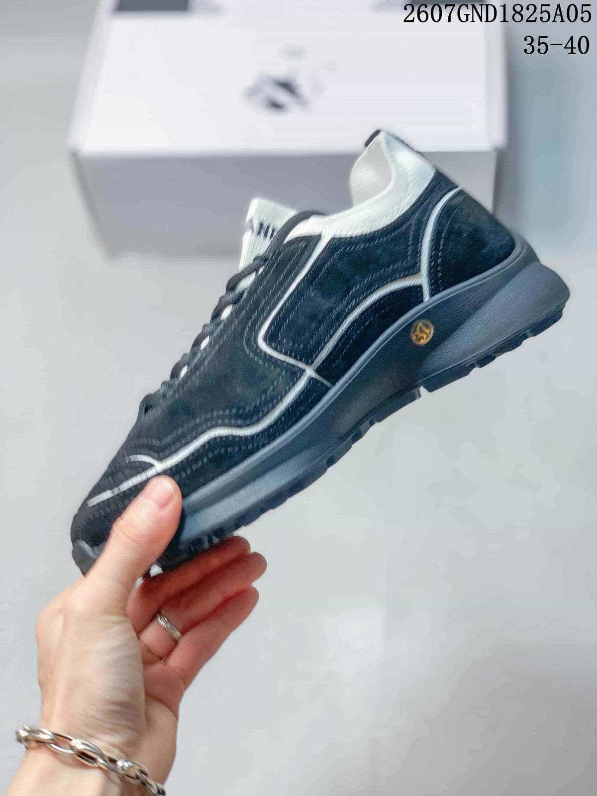 Chanel Low-Top Sneakers in Black and White 2607GND1825A05 - product image from the listing.