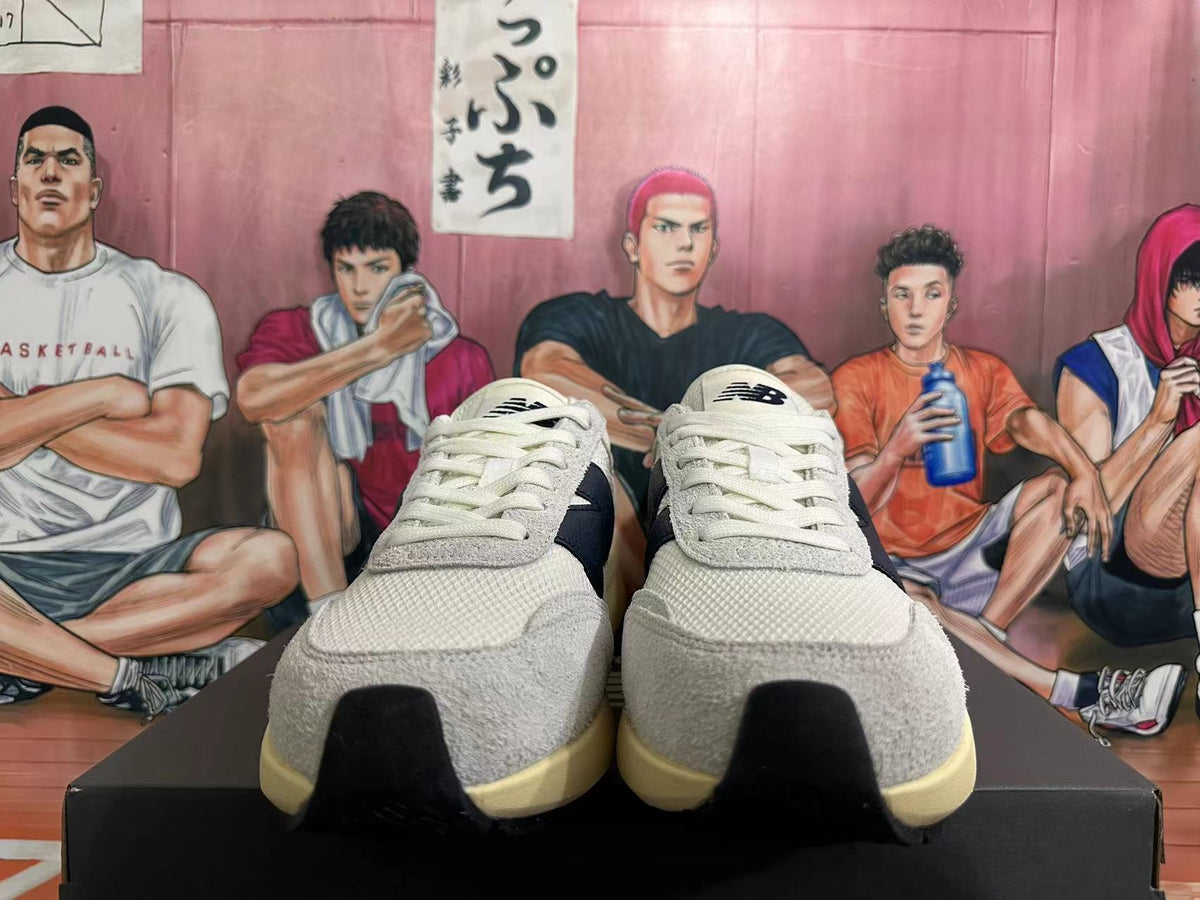 New Balance U370 Sneakers in Off-White and Black - product image from the listing.