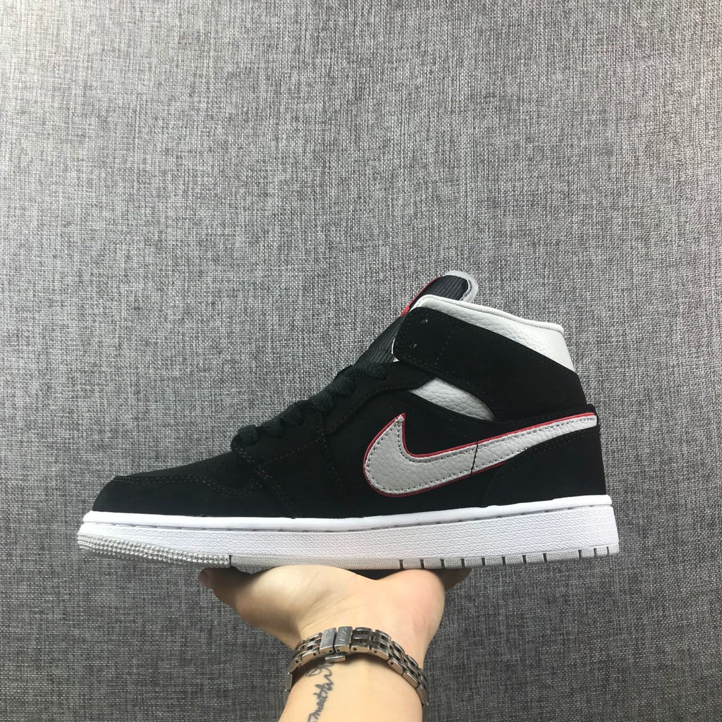 Air Jordan 1 Mid Black, Sneakers in White & Red 554724-060 - product image from the listing.