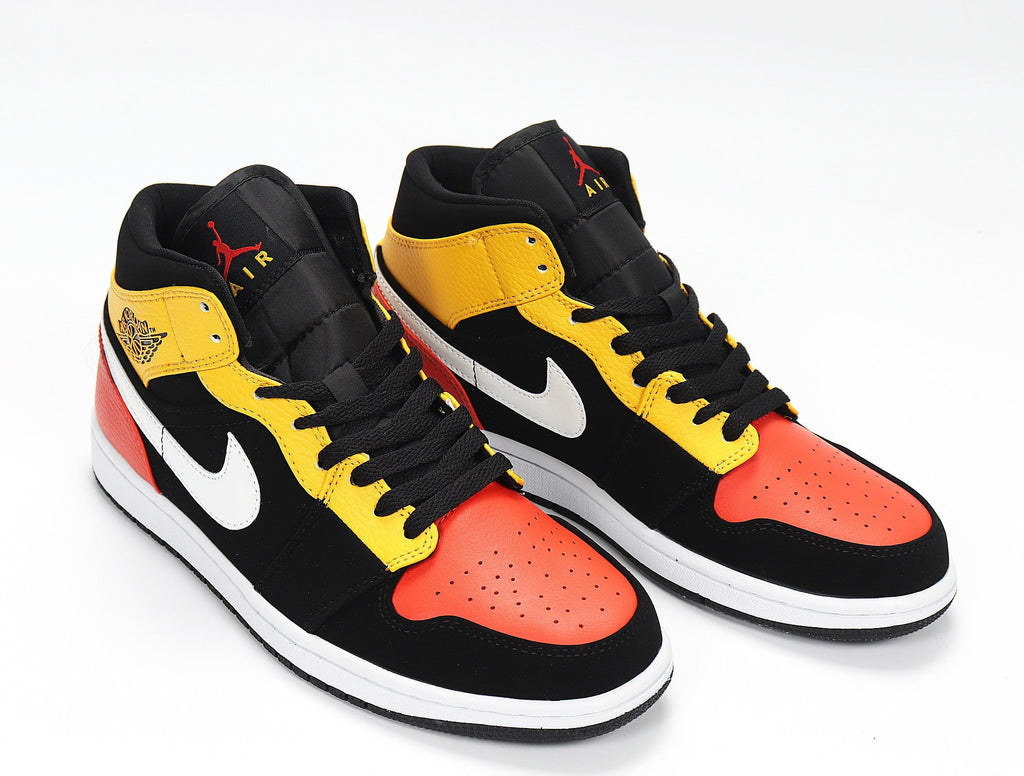 Jordan 1 Low Sneakers in Black Yellow Red 852542-087 - product image from the listing.