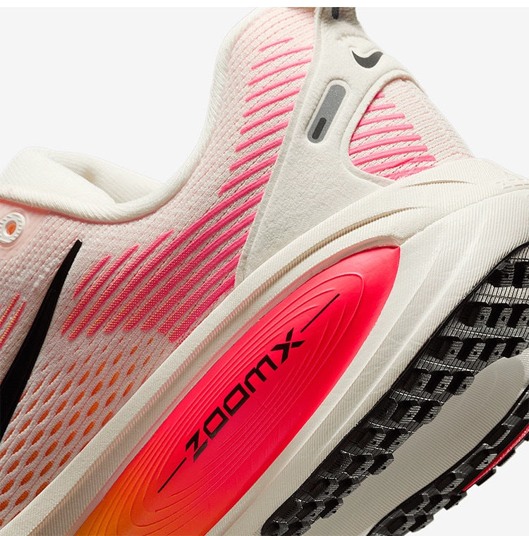 Nike Vomero 18 Running Shoes HM6804-100 in White Orange - product image from the listing.