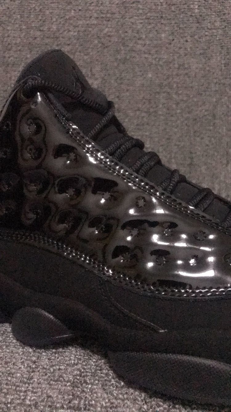 Air Jordan 13 Retro Cap and Gown Sneakers in Black - product image from the listing.