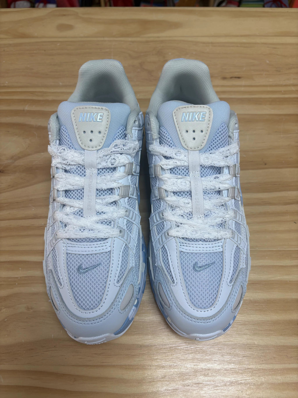 Nike P-6000 Sneakers in White and Blue CV2209-111 - product image from the listing.