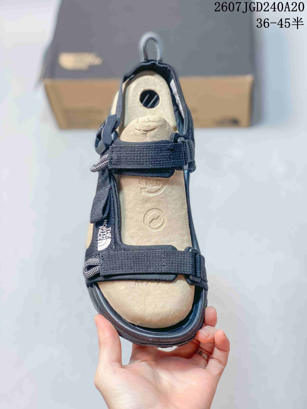 The North Face Explore Camp Sandals in Black and Tan JGD240A20 - product image from the listing.