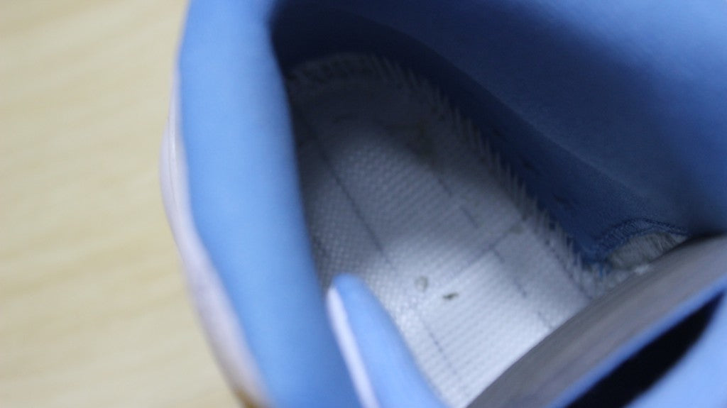 Air Jordan 12 High-Top Sneakers in University Blue 510815-127 - product image from the listing.