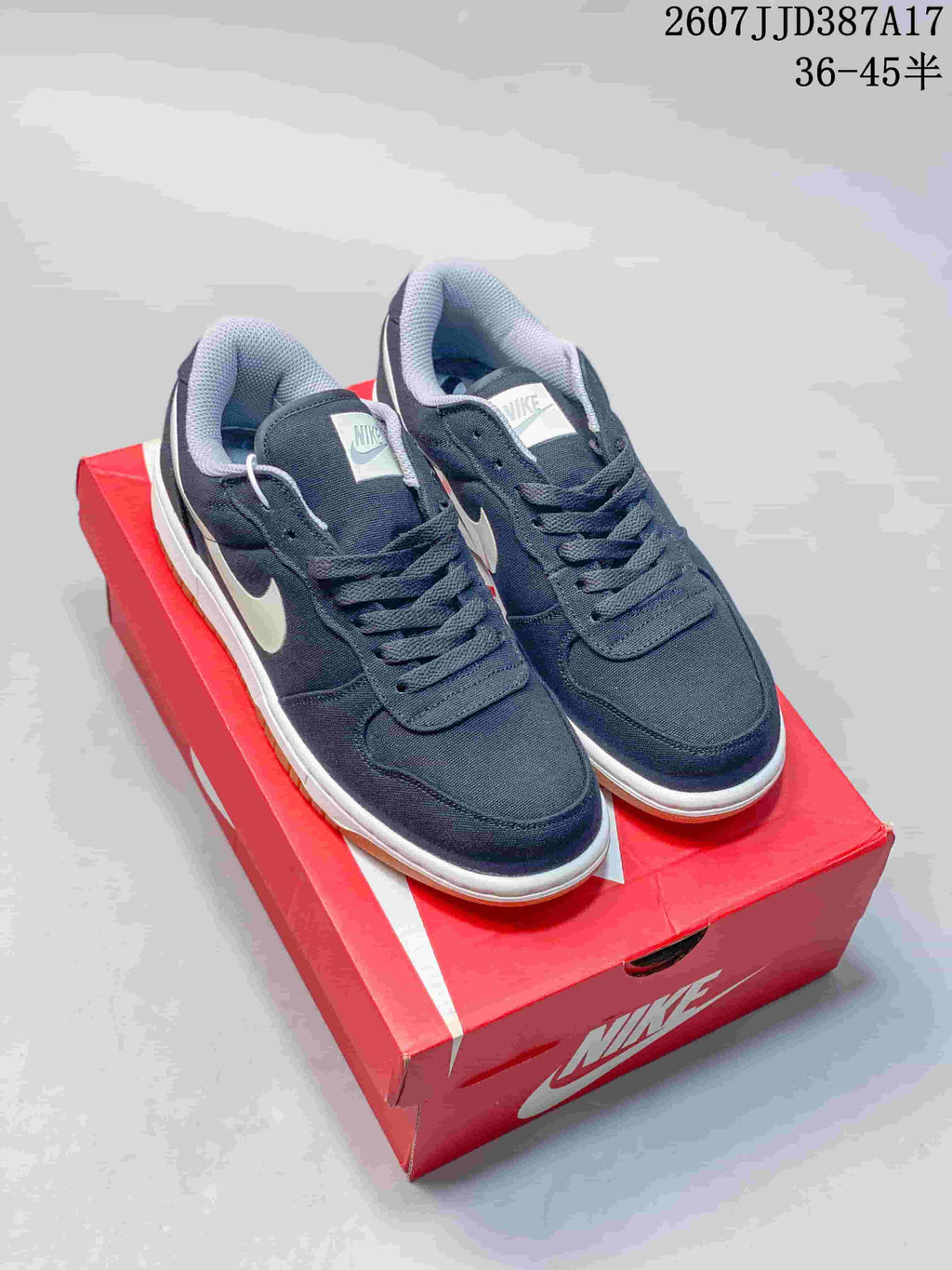 Nike Big Nike Low Sneakers in Black, Green, in White and Navy - product image from the listing.