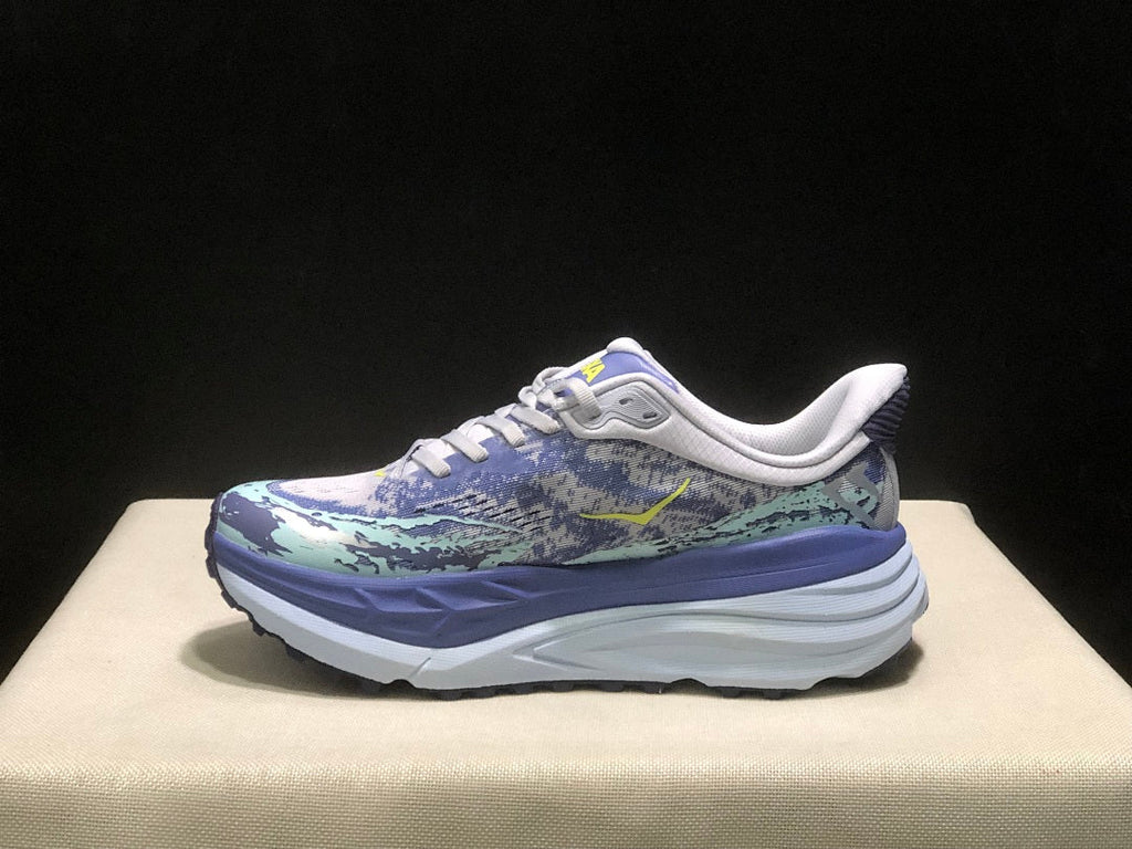 Purple and Mint HOKA Stinson 7 Running Shoes - product image from the listing.