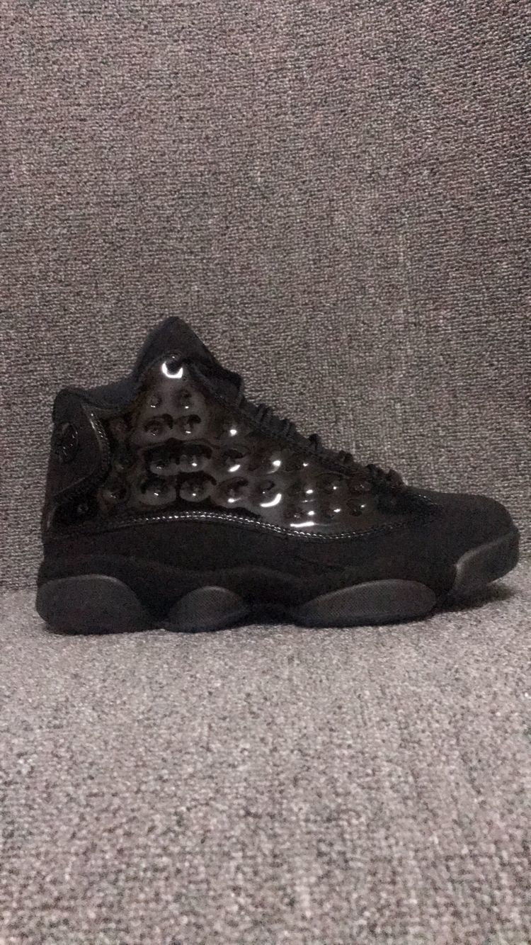 Air Jordan 13 Retro Cap and Gown Sneakers in Black - product image from the listing.